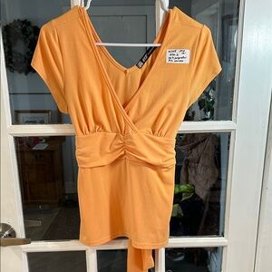 W105.    Orange Wrap Front Knit Top